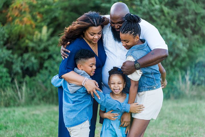 black family hugging