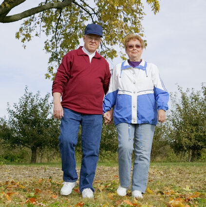 older white couple walking