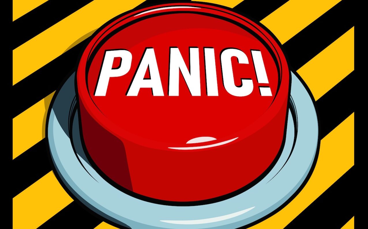 Big red panic button on yellow and black panel.