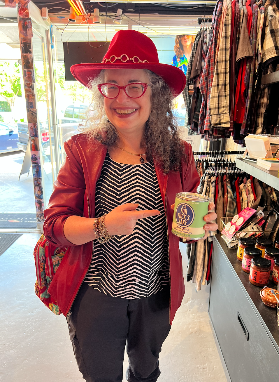 Dori smiling in a red hat and jacket